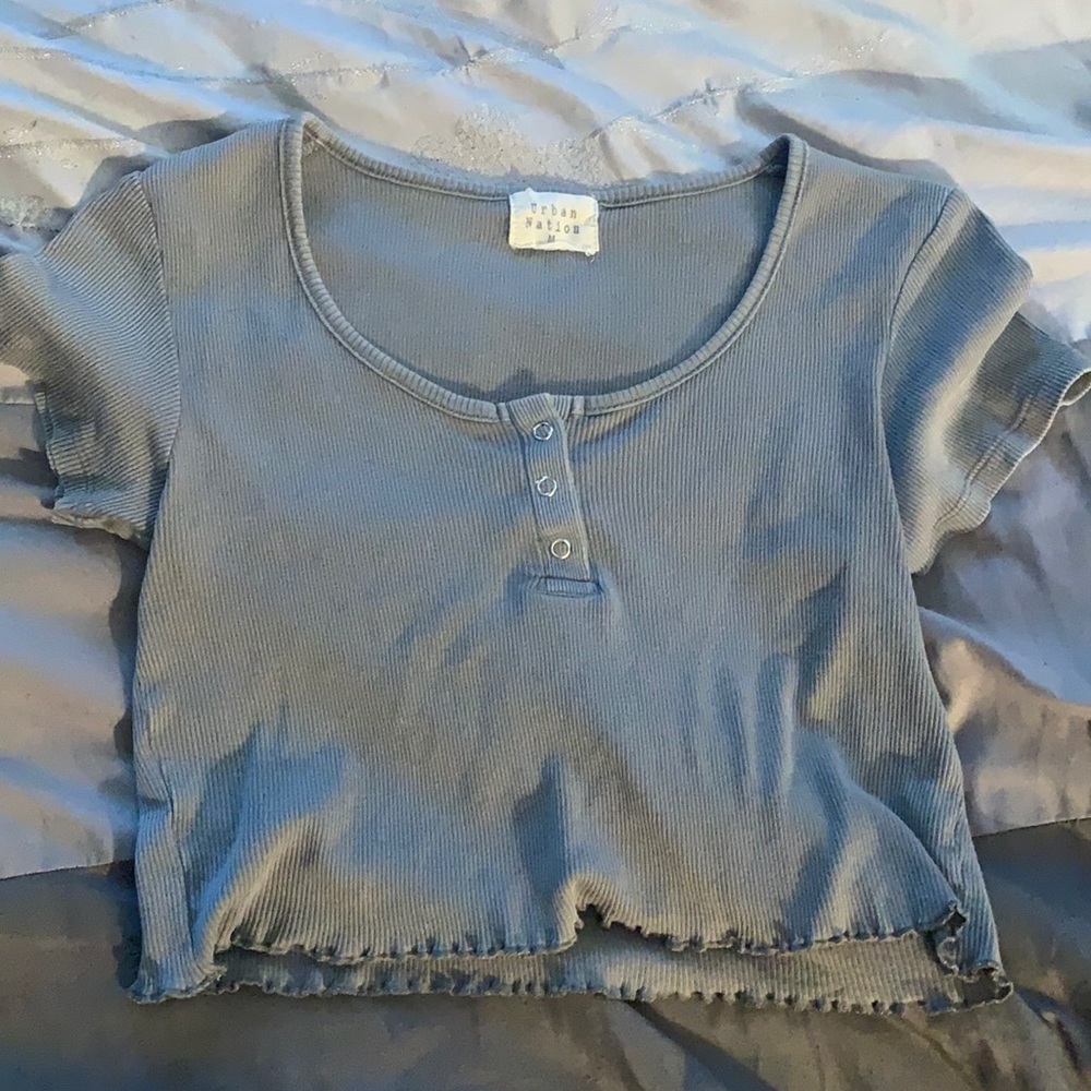 A cropped shirt, brand urban nation, size m, in sage green.